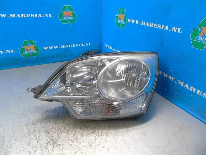 Headlight, left Opel Antara