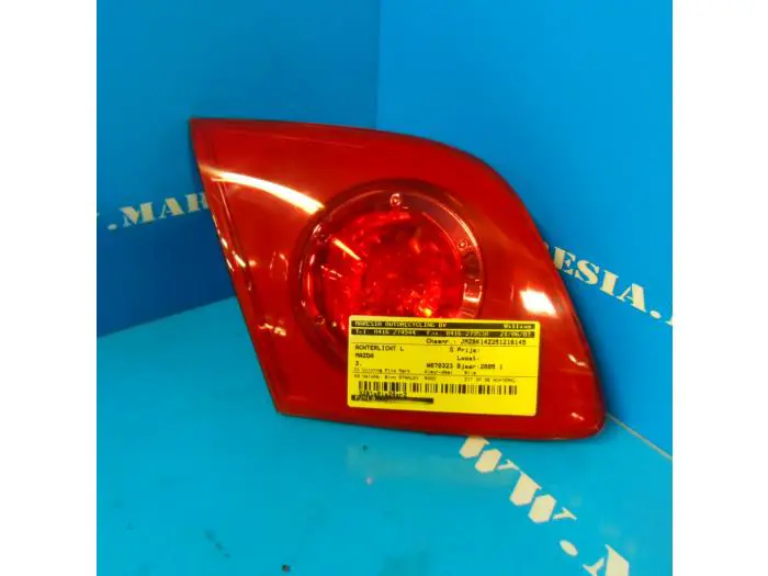 Taillight, left Mazda 3.