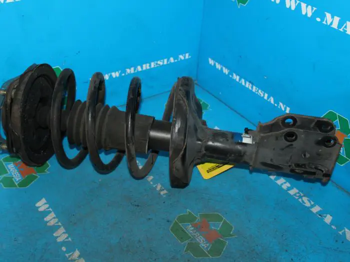 Front shock absorber rod, left Mazda 323