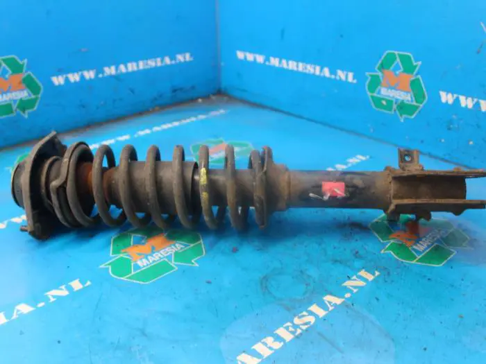 Fronts shock absorber, left Suzuki Wagon R+